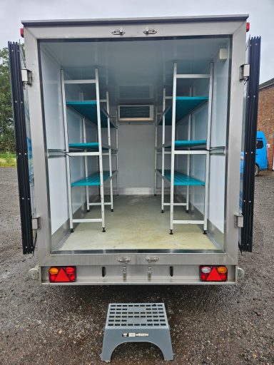 View of inside the trailer showing step and racking
